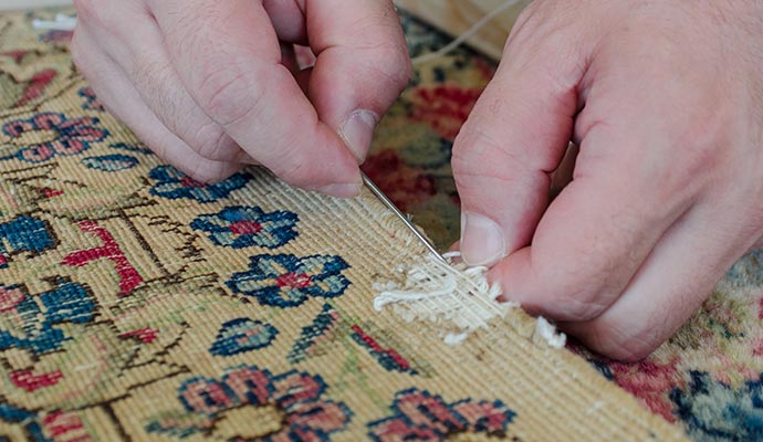 Restoring a damaged rug to its former beauty through expert care and attention