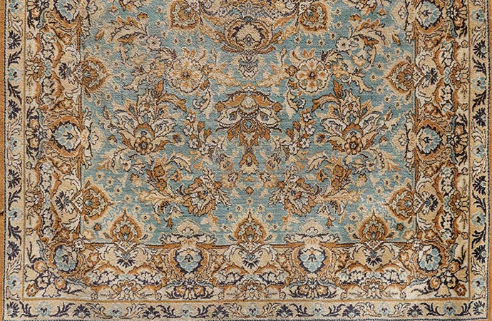 antique old oriental carpet close up shot