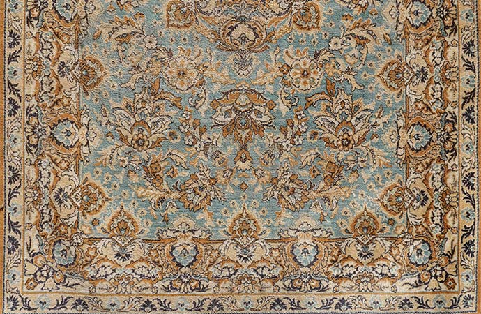 antique old oriental carpet close up shot
