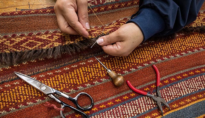 repairing rug by hand